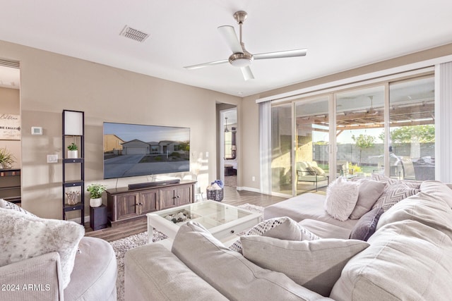 living room with hardwood / wood-style floors and ceiling fan