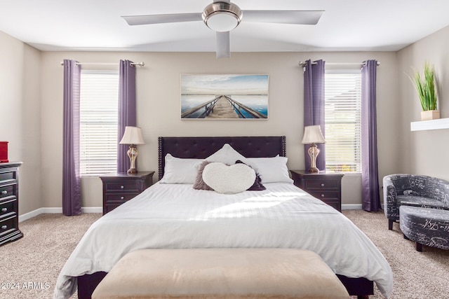 bedroom featuring ceiling fan and light carpet