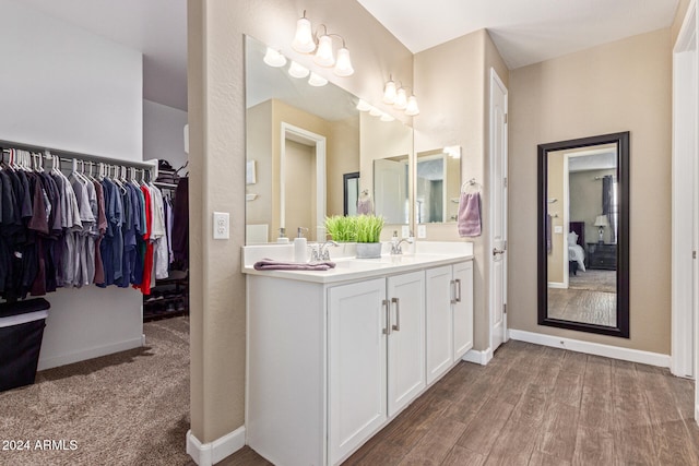 bathroom featuring hardwood / wood-style floors and vanity