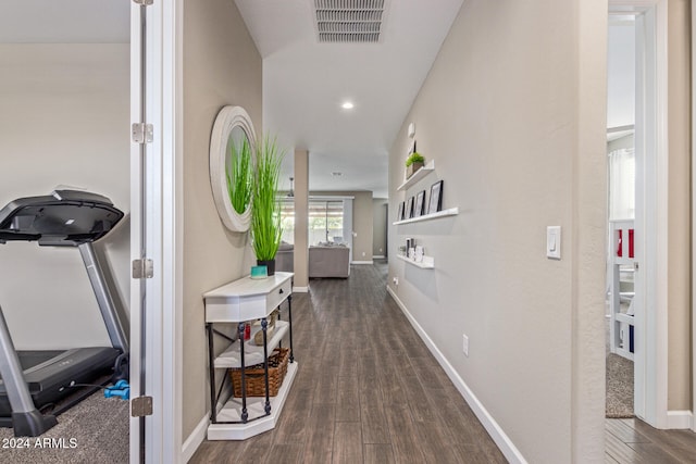 corridor with dark hardwood / wood-style floors