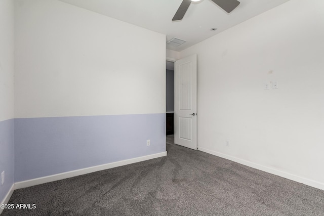 carpeted spare room featuring visible vents, baseboards, and ceiling fan