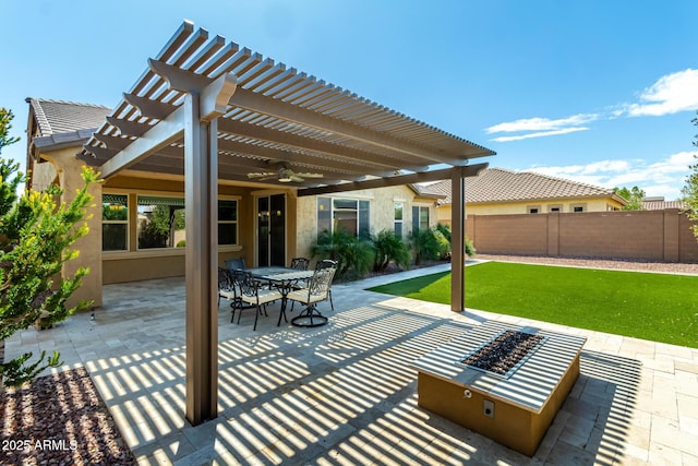 view of patio / terrace with fence, outdoor dining area, a pergola, ceiling fan, and a fire pit