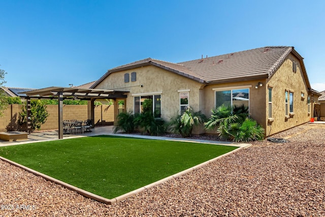 back of property with a patio, fence, a pergola, stucco siding, and a tile roof