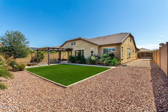 rear view of property with a fenced backyard, a pergola, stucco siding, a tiled roof, and a patio area