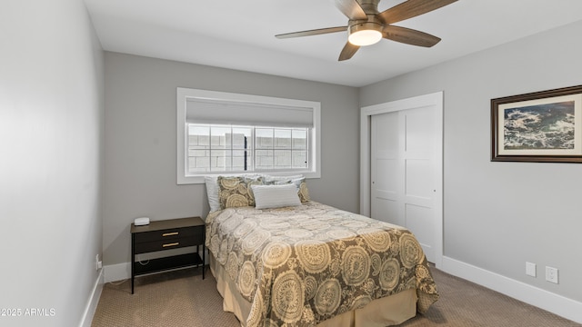 bedroom featuring a closet, ceiling fan, baseboards, and carpet floors