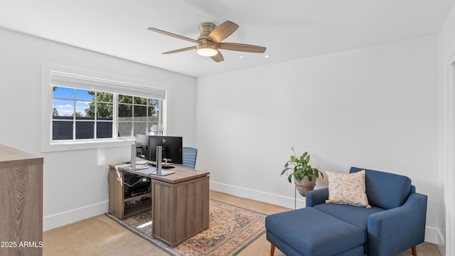 office featuring baseboards and a ceiling fan