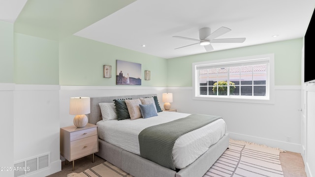 bedroom with visible vents and a ceiling fan