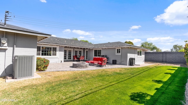 rear view of property with a patio area, a yard, central AC, and fence