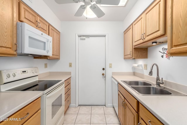 kitchen featuring ceiling fan, white appliances, sink, and light tile patterned floors