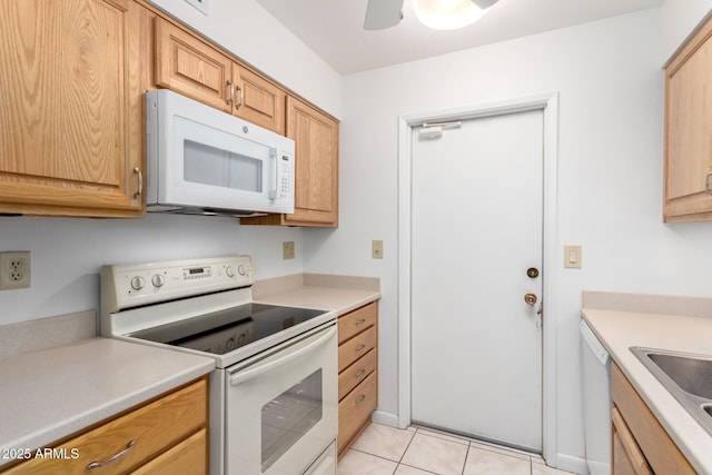 kitchen featuring sink, white appliances, ceiling fan, and light tile patterned flooring