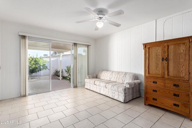 tiled living room featuring ceiling fan