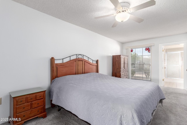 bedroom featuring ceiling fan, carpet floors, connected bathroom, and a textured ceiling