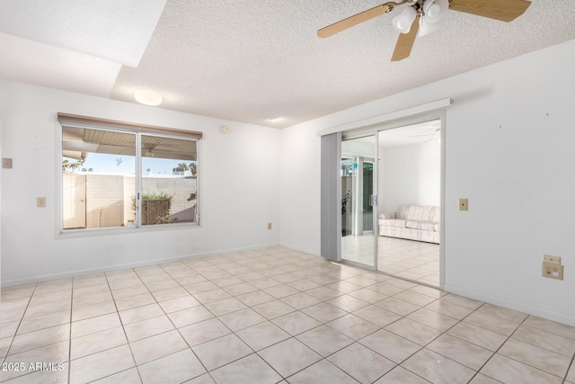 spare room featuring ceiling fan and a textured ceiling