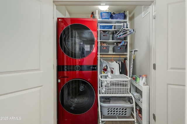 laundry room with stacked washer / dryer