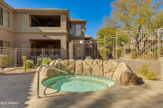 view of pool with a community hot tub