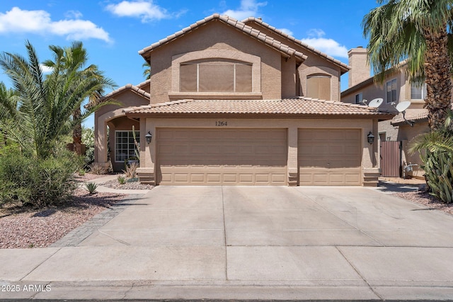 1264 S Sierra St, Gilbert, AZ 85296 - mediterranean / spanish-style home featuring concrete driveway, stucco siding, a garage, and a tile roof