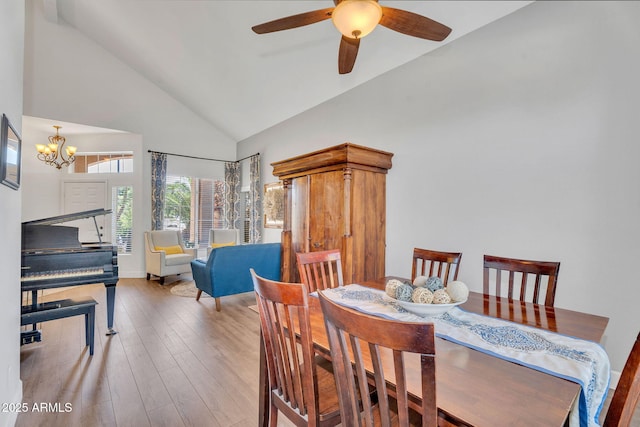 1264 S Sierra St, Gilbert, AZ 85296 - dining space with high vaulted ceiling, a chandelier, wood finished floors, and a ceiling fan
