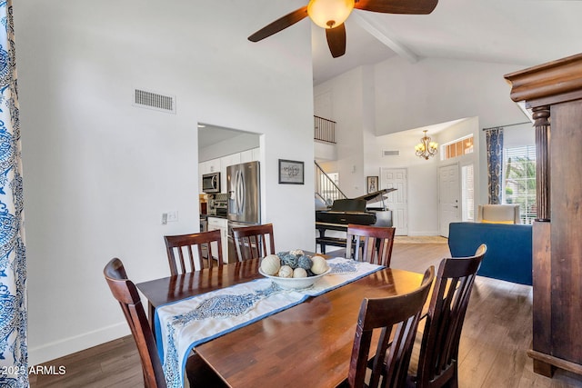 1264 S Sierra St, Gilbert, AZ 85296 - dining space featuring stairway, a ceiling fan, wood finished floors, high vaulted ceiling, and baseboards
