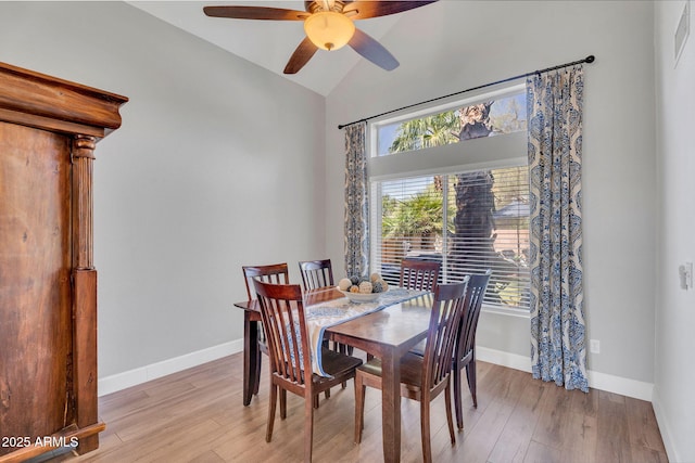 1264 S Sierra St, Gilbert, AZ 85296 - dining space with a ceiling fan, light wood finished floors, vaulted ceiling, and baseboards