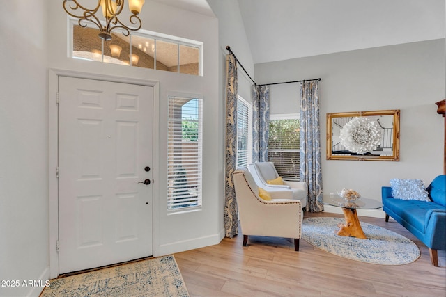 1264 S Sierra St, Gilbert, AZ 85296 - entrance foyer featuring a chandelier, wood finished floors, baseboards, and high vaulted ceiling