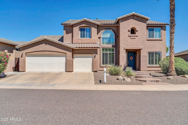 mediterranean / spanish house featuring a garage