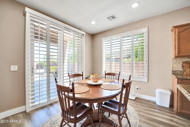 dining room with hardwood / wood-style flooring