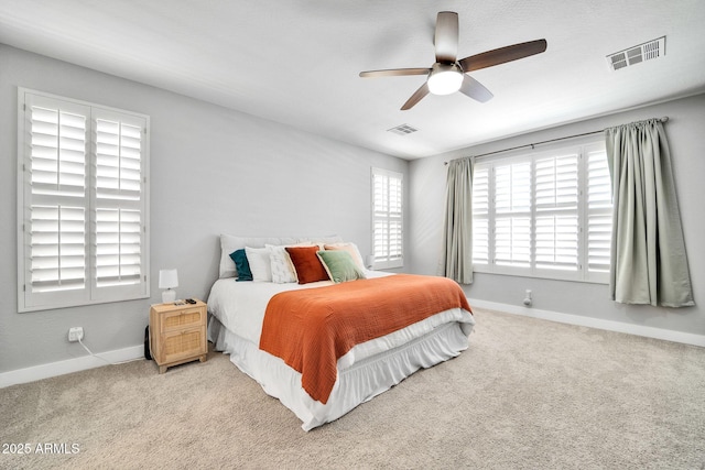 bedroom with light colored carpet and ceiling fan