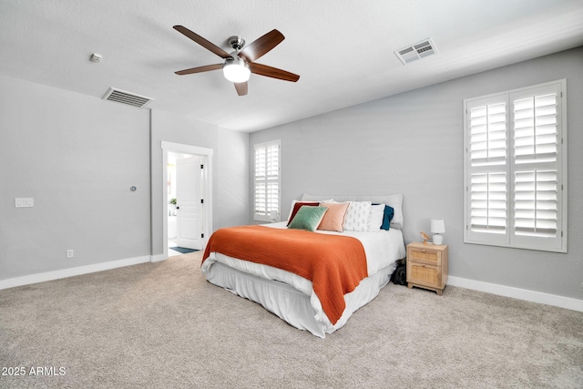 bedroom featuring light carpet and ceiling fan