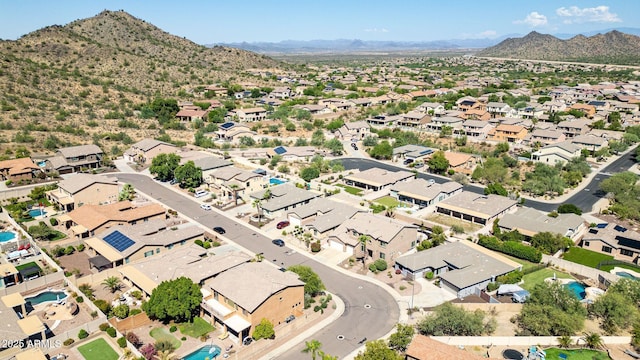 birds eye view of property featuring a mountain view