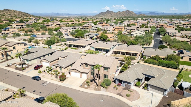 birds eye view of property with a mountain view