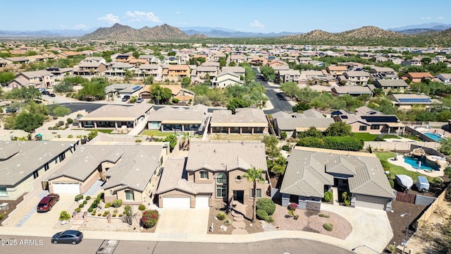 birds eye view of property featuring a mountain view