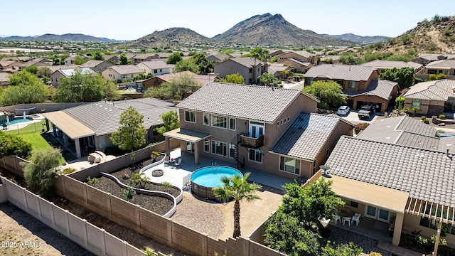 birds eye view of property featuring a mountain view