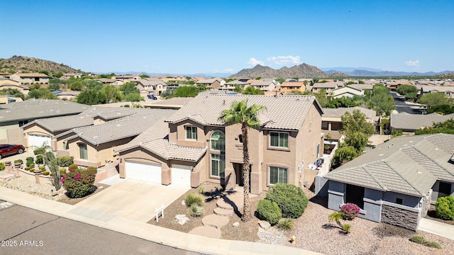 drone / aerial view featuring a mountain view