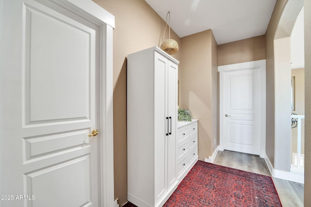 hallway featuring hardwood / wood-style floors