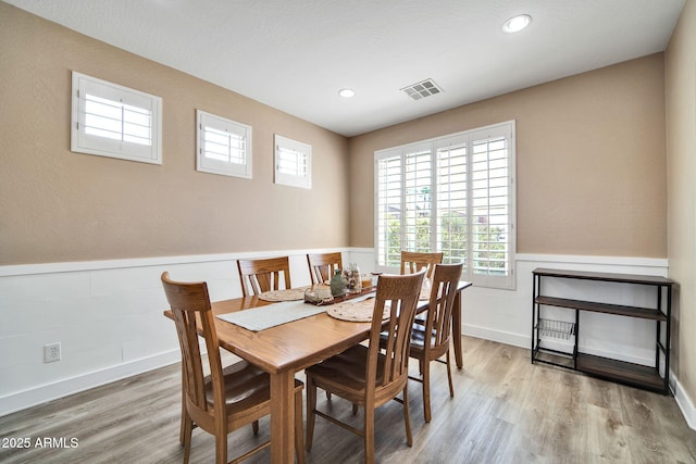 dining area with wood-type flooring