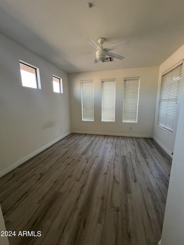 spare room with ceiling fan and hardwood / wood-style floors