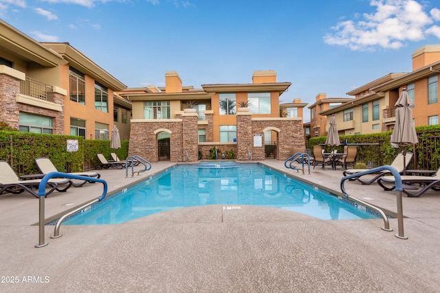 view of pool featuring a patio area