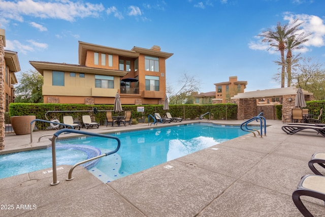 view of pool featuring a patio