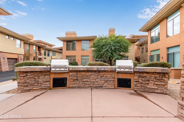 view of patio featuring a grill and exterior kitchen