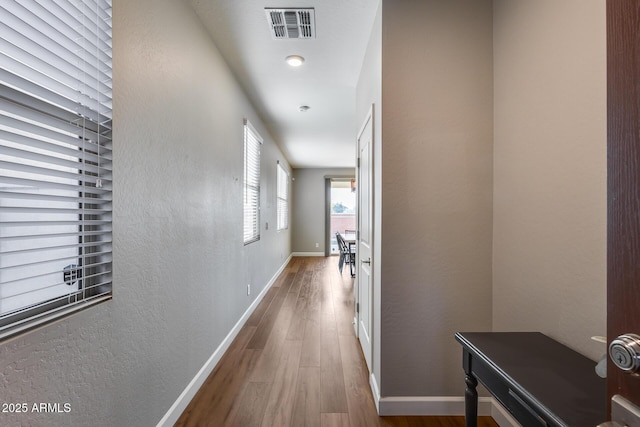 corridor featuring wood-type flooring