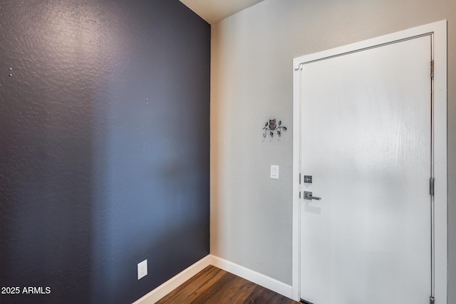 foyer with dark hardwood / wood-style floors