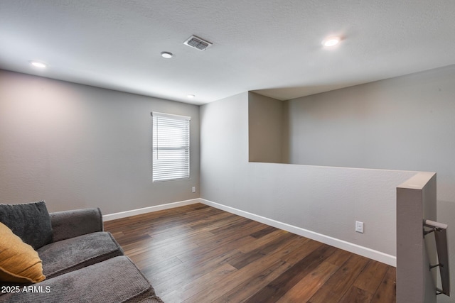 living area with dark hardwood / wood-style flooring