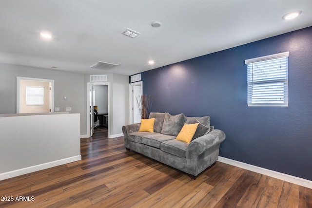 living room featuring dark hardwood / wood-style floors