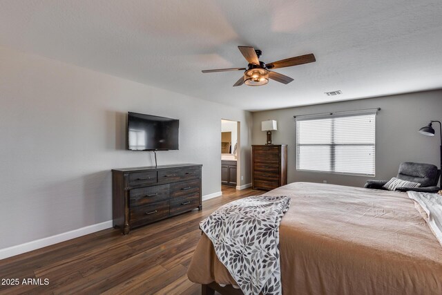 bedroom with ceiling fan and dark wood-type flooring