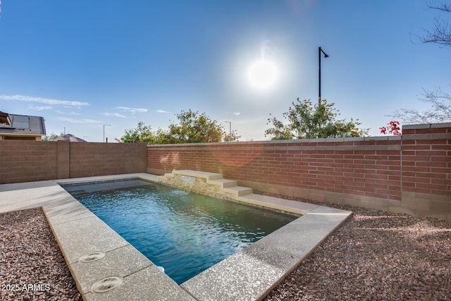 view of swimming pool featuring pool water feature