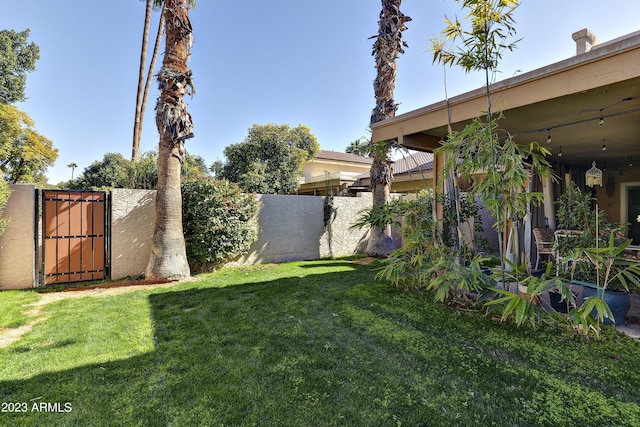 view of yard featuring a gate and fence