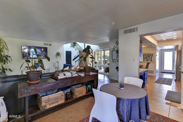 tiled dining area with visible vents