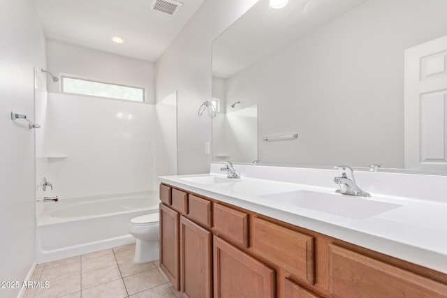 full bathroom with tile patterned floors, toilet, shower / bathing tub combination, and vanity