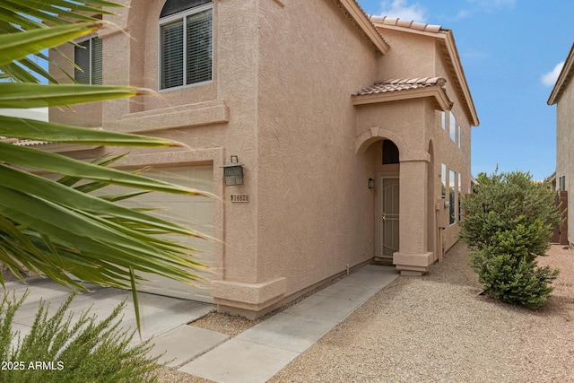 entrance to property featuring a garage