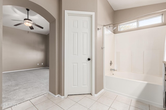 bathroom featuring  shower combination, ceiling fan, and tile patterned floors